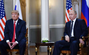 Russian President Vladimir Putin and US President Donald Trump attend a meeting in Helsinki.
