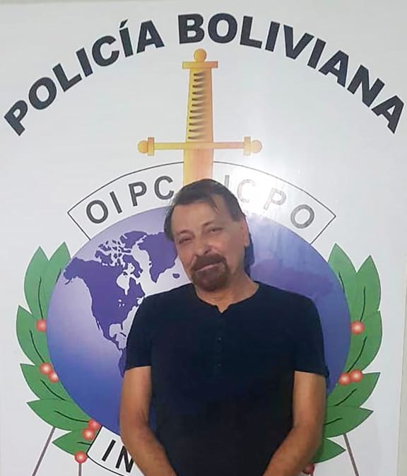 A handout picture taken by the Bolivian police forces and released on January 13, 2019 shows former far-left Italian militant Cesare Battisti after he was arrested late on January 12, 2019 in the Bolivian city of Santa Cruz de la Sierra.