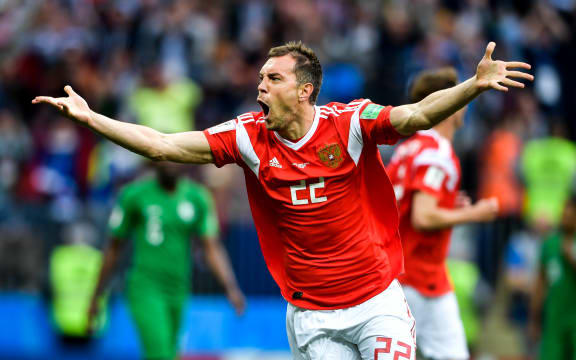 Artem Dzyuba of Russia celebrates after scoring a goal against Saudi Arabia in their Group A match during the 2018 FIFA World Cup in Moscow, Russia, 14 June 2018.