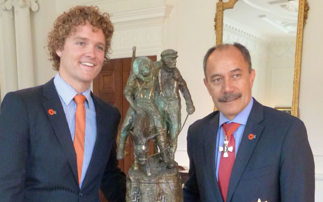 Sam Johnson, organiser of the Student Volunteer Army, left, and Governor General Sir Jerry Mateparae with 'The Governor General's ANZAC of the Year Trophy.