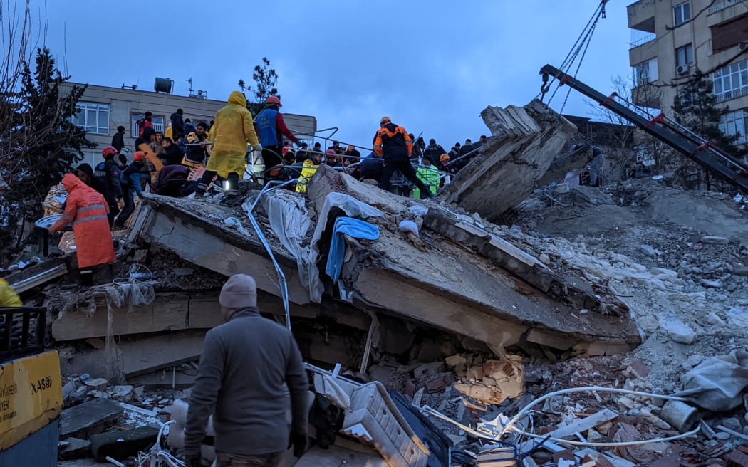 Rescue workers and volunteers search for survivors in the rubble of a collapsed building, in Sanliurfa, Turkey, on 6 February 6, 2023, after a 7.8-magnitude earthquake struck the country's south-east.