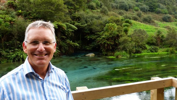 The chief executive of The South Waikato District Council, Craig Hobbs stands in front of  The Blue Spring, near Putaruru.