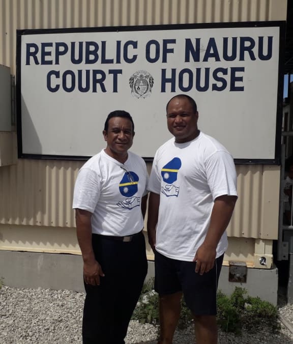 Two of former MPs, Squire Jeremiah and Mathew Batsiua after the decision