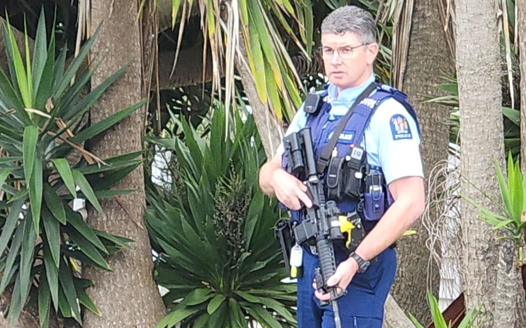 Police on Bardia Street in Belmont, Auckland.