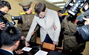 Otto Warmbier admitted stealing a propaganda sign during a trip to North Korea.