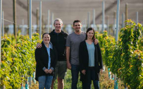 Rachel White, Euan White, Mike Casey and Rebecca Casey at their Forest Lodge Orchard.