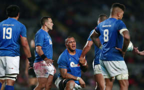 Manu Samoa players, including captain Kahn Fotuali'i (2L), react after their 78-0 thrashing by the All Blacks.