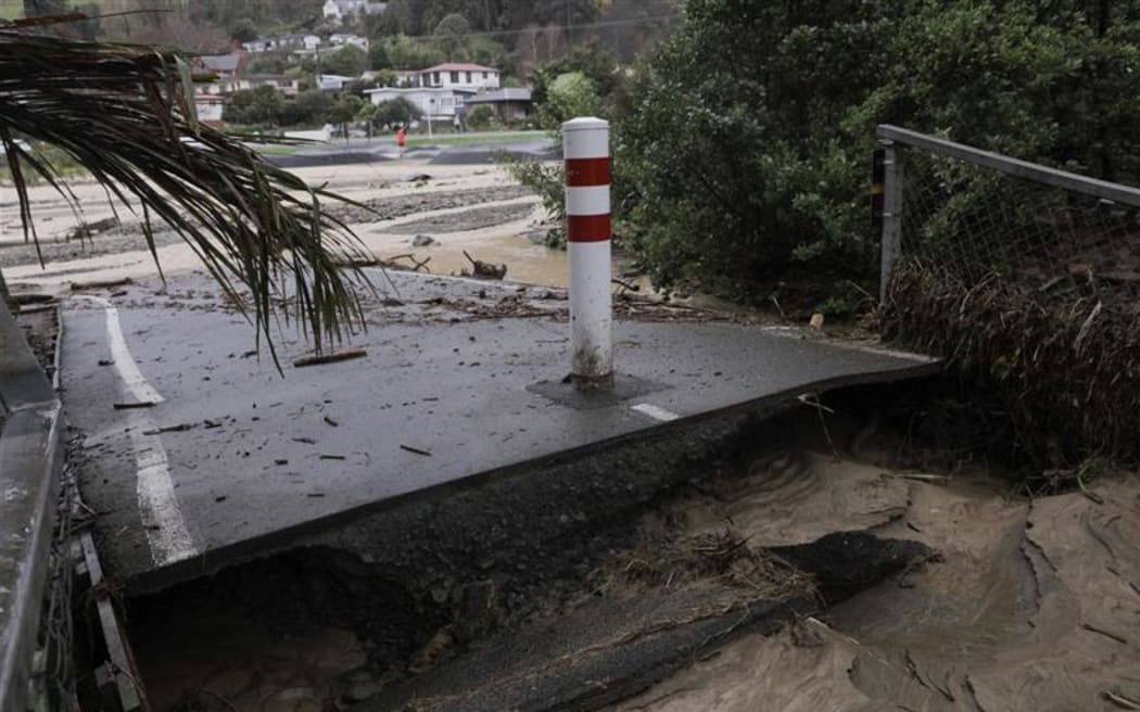 Road damage after flood water receded.