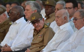 Raul Castro and President Miguel Diaz-Canel (second from left) take part in the celebration of the 60th anniversary of the Cuban revolution at the Santa Ifigenia Cemetery in Santiago de Cuba.