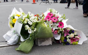 Flowers are left at a memorial to earthquake victims in central Christchurch on March 1, 2011.