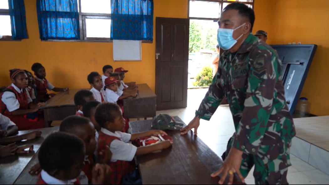 Indonesian military officer addresses a school class in West Papua, September 2021