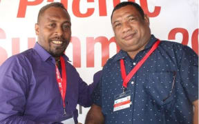 Solomons Media Association president Charles Kadamana, (left), congratulates Kora Nou.