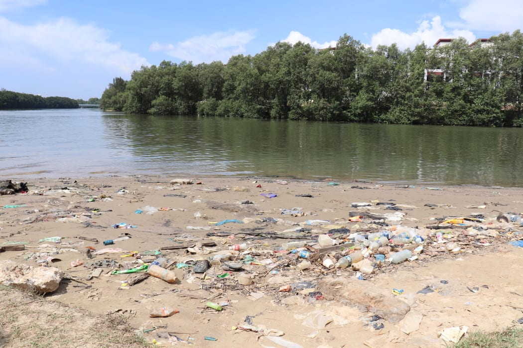 Plastic waste litters a river near Kota Kinabalu.