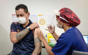 Drew Faiva, one of Auckland's Jet Park Hotel quarantine facility workers being vaccinated against Covid-19 on 20 February 2021.