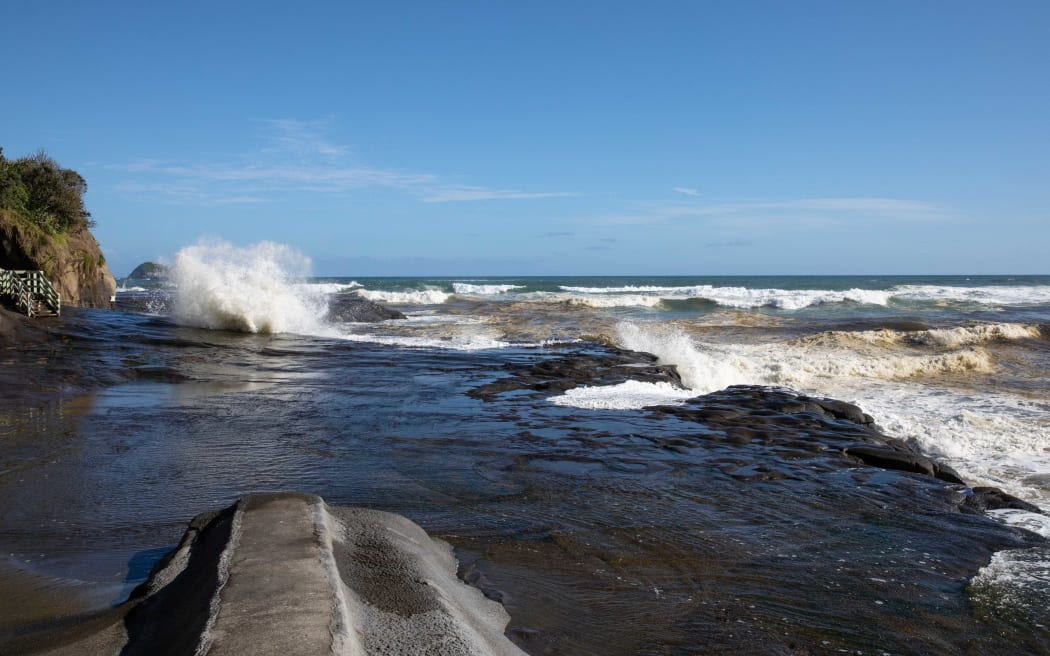 Muriwai Beach the day after a Burmese couple drowned while fishing off the rocks.