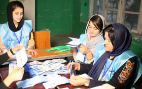 KABUL, AFGHANISTAN-SEPTEMBER 28: Election commission members count ballots as the landmark Afghan presidential polls ended in Kabul, Afghanistan on 28 September 2019.