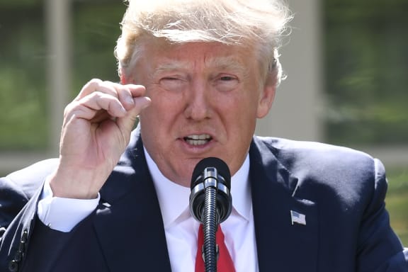 "As of today, the United States will cease all implementation of the non-binding Paris accord and the draconian financial and economic burdens the agreement imposes on our country," Trump said.