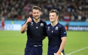 Peter Horne - Scotland centre along side his treble scoring brother George at the end of the match as both players celebrate a 61-0 victory over Russia.