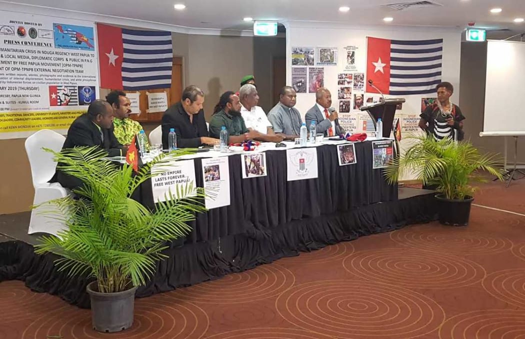 Governor of Papua New Guinea's National Capital Powes Parkop (with mic) speaks at OPM (Free Papua Movement) press conference in Port Moresby 31 January 2019