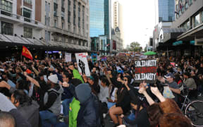 Black Lives Matter protesters take a knee outside the US consulate in central Auckland on 14 June, 2020.