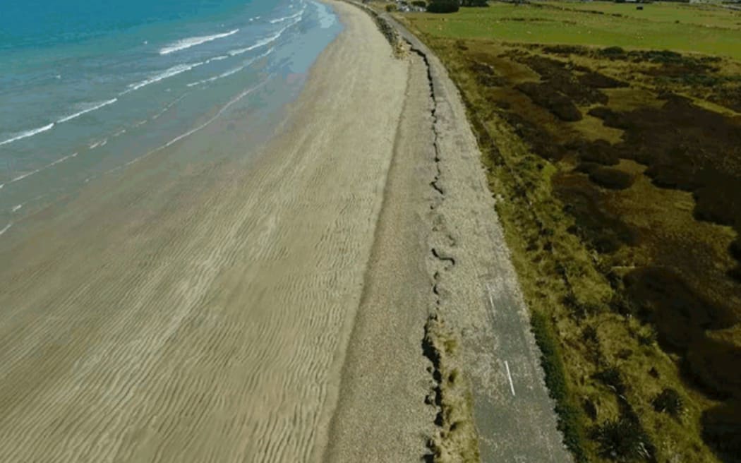 Photographs show the level of erosion along the coastal road.
