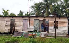 Residents at the Nanuku informal settlement in Vatuwaqa secure their home before evacuating ahead of Cyclone Yasa.