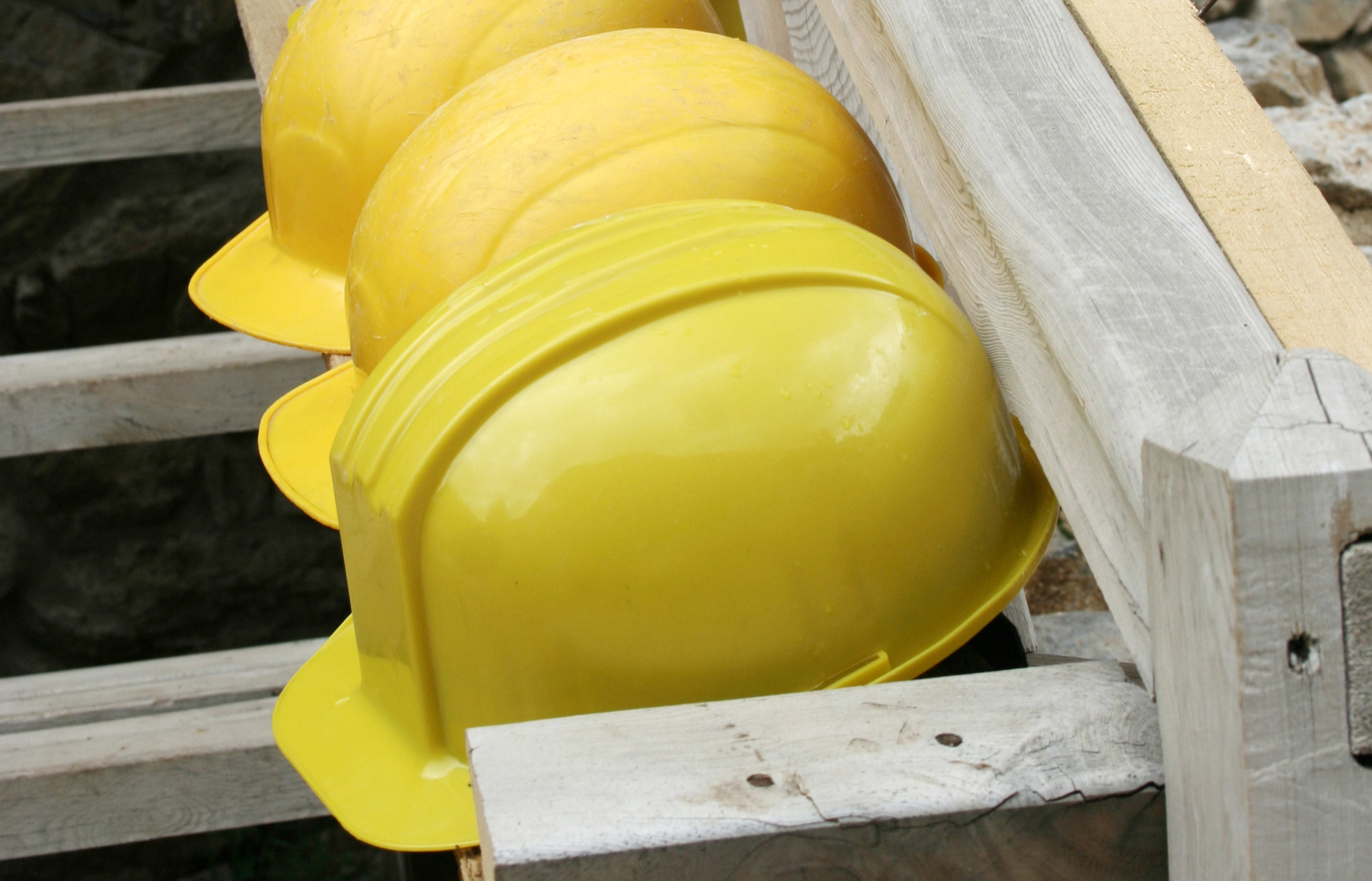 A row of mine workers' hard hats
