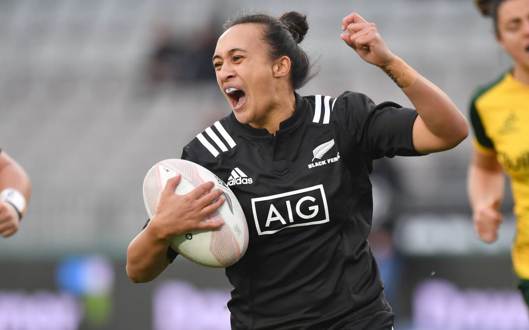 Black Ferns Ruahei Demant celebrates as she runs in a try against Australia 2019.