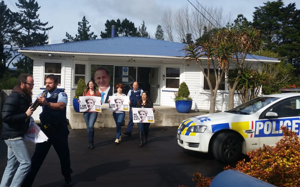 Show Us Ya Text protesters were moved on from John Key's electoral office by police.