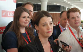 Claire Szabo (centre) talks to the media after her election as Labour president at the party's annual conference in Whanganui.
