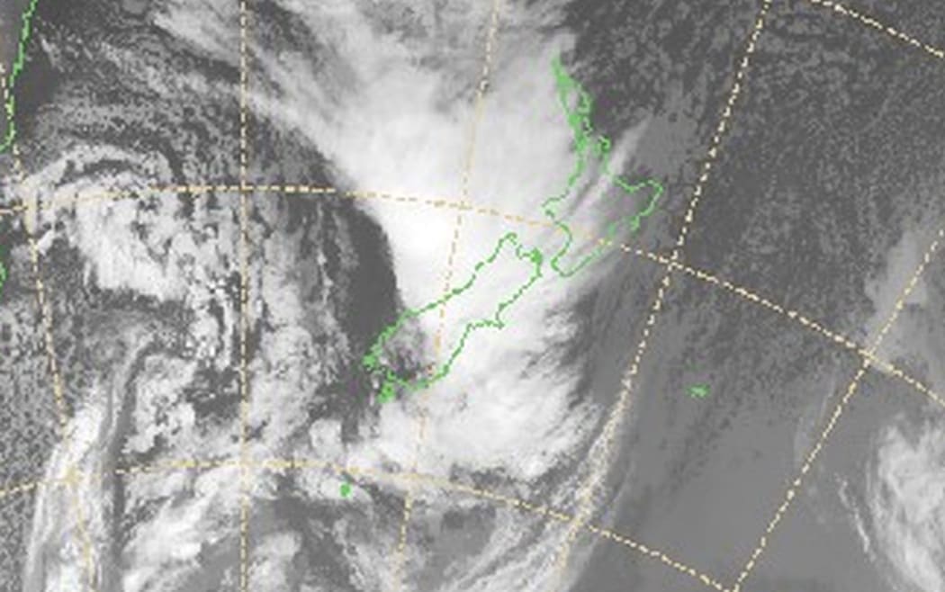 Sattelite image from 11am show a front sweeping across New Zealand, bringing heavy rain, strong winds and snow.