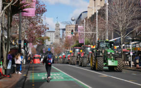 Protesters in utes and tractors driving down Queen St, Auckland.