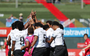 The Fijiana team huddle during the game against Canada in Dubai.