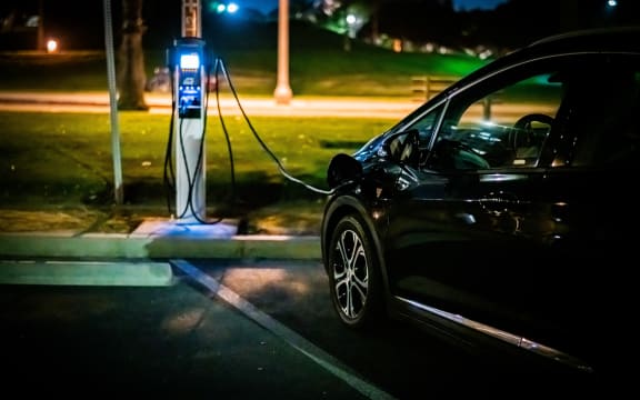 An electric vehicle being charged.