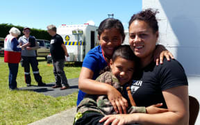 Koko Lambert with her daughter Tiara, 7, and son Elijah, 6, at the Ward emergency welfare centre.