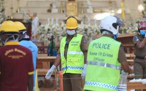 Investigators working in St. Sebastian Church in Negombo, Sri Lanka on April 23, 2019, two days after the church was hit in series of bomb blasts targeting churches and hotels.