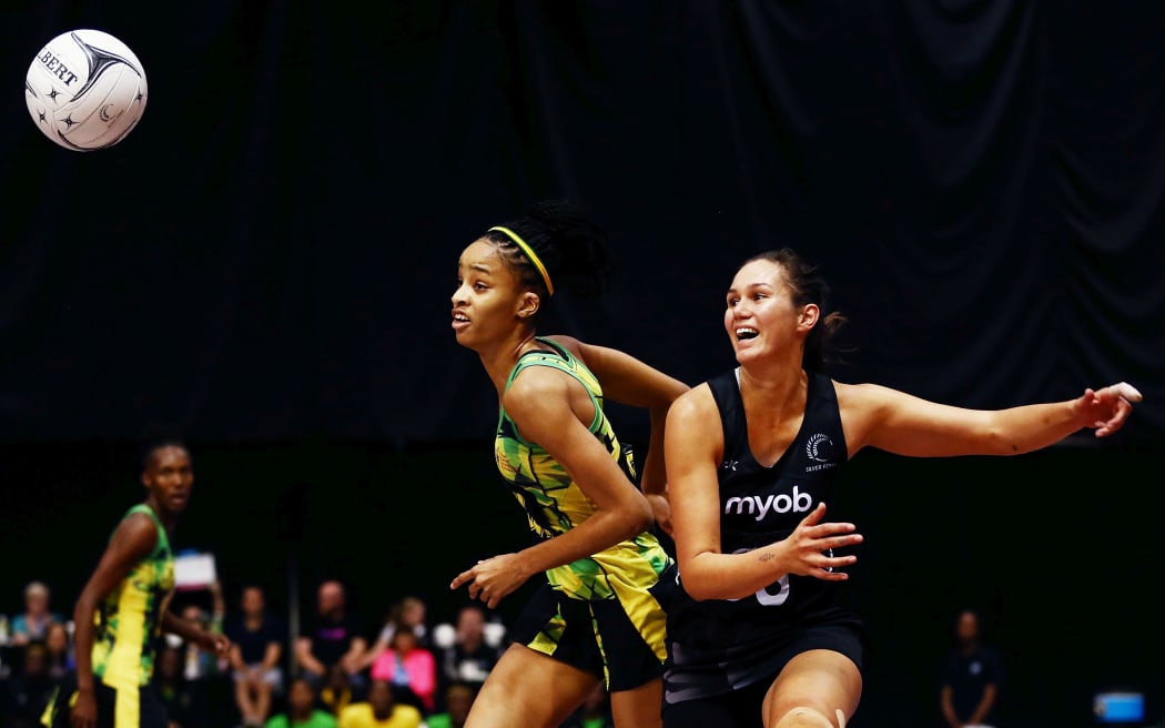 Jamaican defender Shamera Stirling (L) playing in the 2018 Taini Jamison Trophy Series against the Silver Ferns