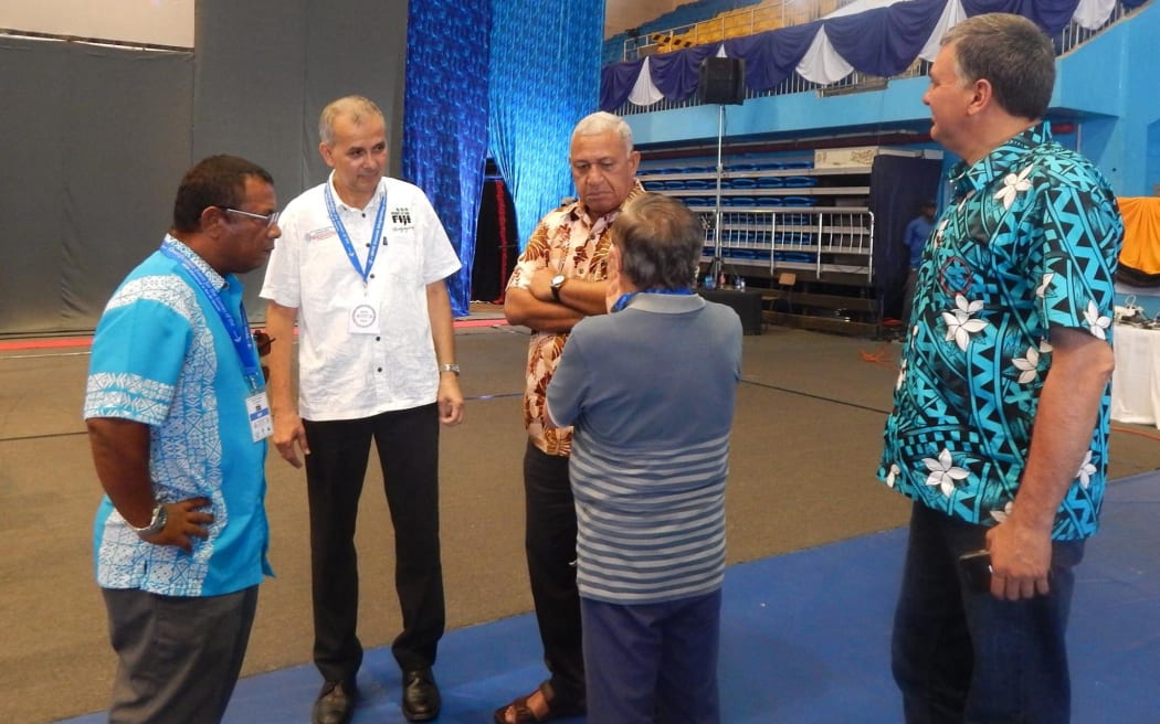 Weightlifting Fiji President Atma Maharaj (2L).