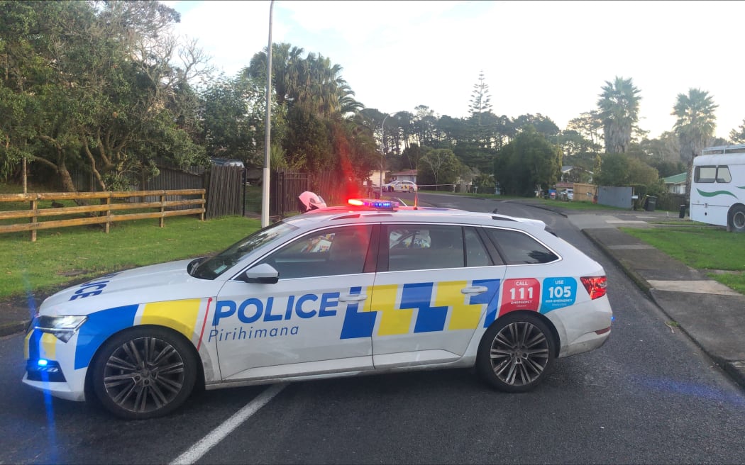 Police cordons off both sides of Barrys Rd in Glendene after the fatal shooting of two people in the West Auckland suburb.