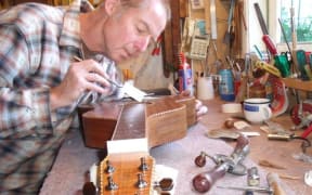 Luthier Paddy Bergin working on one of his home-made guitars