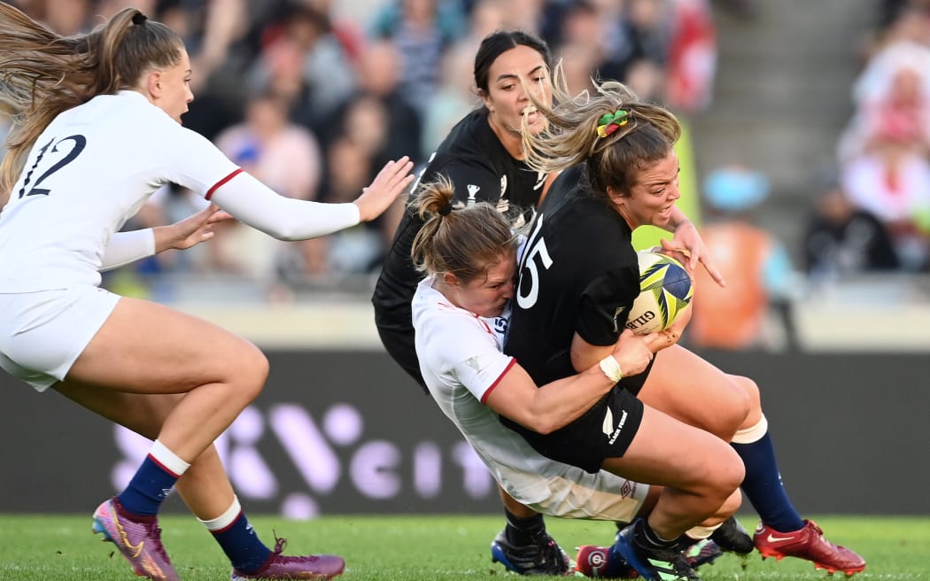 Black Fern Renee Holmes is tackled during the Rugby World cup final against England.