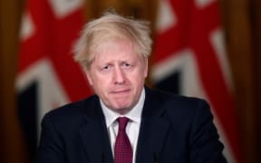 Britain's Prime Minister Boris Johnson announces the restrictions during a virtual media conference inside 10 Downing Street in central London on 19 December 2020.