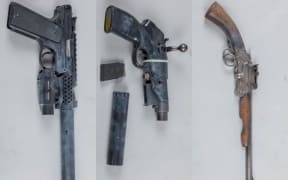 Three pistols and a set of ballistic armour were seized by police after a search warrant in Napier.