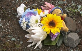 Flowers mark the spot where Hannah Francis died after a Ruapehu Alpine Lifts bus crashed while descending the mountain.