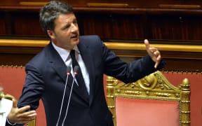 Italian Prime Minister Matteo Renzi gives a speech at the Upper House of Parliament in Rome on April 22, 2015, after observing a minute of silence in memory of the 800 migrants feared to have died when a boat packed with migrants capsized near Libya.