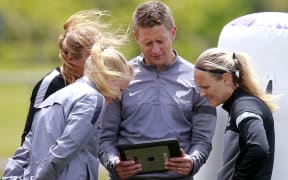 Football Ferns coach Tony Readings look over training footage.