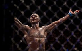 Israel Adesanya put his hands up after his win against Rob Wilkinson, Perth, Australia. 10 February 2018.