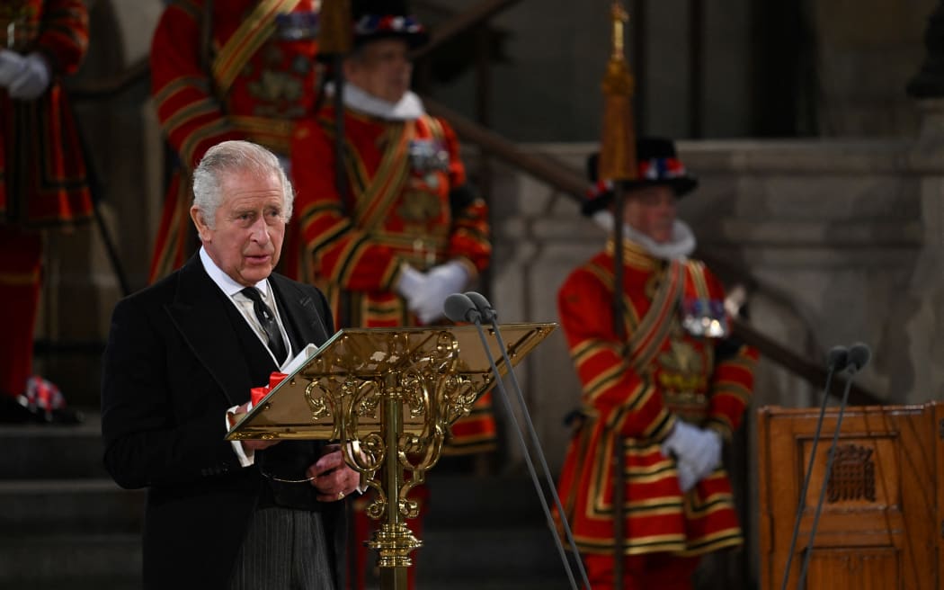 A handout photograph released by the UK Parliament shows King Charles III attending the presentation of Addresses by both Houses of Parliament in Westminster Hall, inside the Palace of Westminster, central London on 12 September 2022.