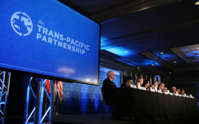 US Trade Representative Michael Froman (6th from left) and delegates from 11 countries at a media conference announcing the agreement.