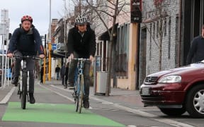 Cyclists on the St Asaph Street cycleway in central Christchurch have to watch out for cars pulling across it.